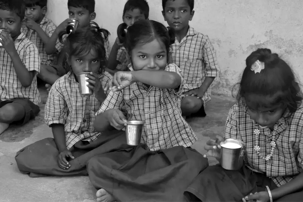 Underprivileged school children in Tamil Nadu receiving nutritious mid-day meal support from V V Charitable Trust.